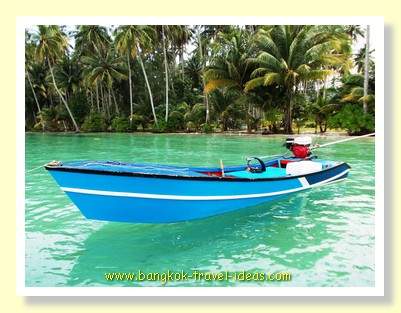 Fishermans boat moored at the jetty at Dusita Resort Fishermans boat moored at the jetty at Dusita Resort