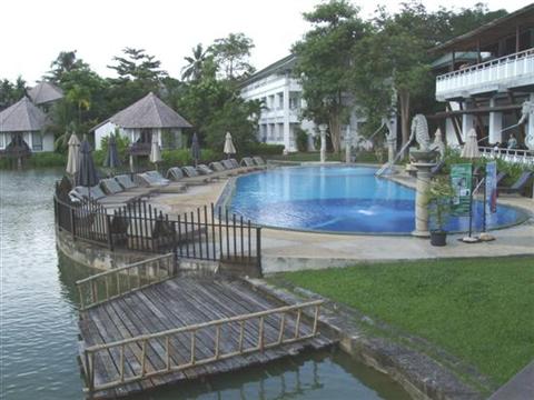 Peace Laguna Resort and Spa serves breakfast overlooking the pool and cottages Peace Laguna Resort and Spa serves breakfast overlooking the pool and cottages