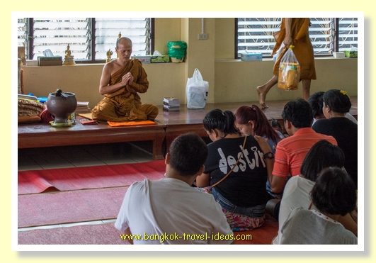 Monk's blessing at Wat Asokaram