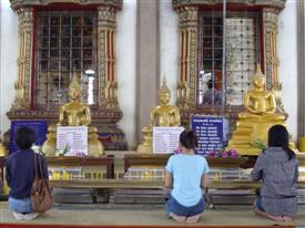 Worshippers gather to say a prayer