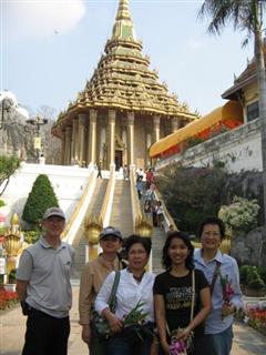 A  group of friends at the base of the ornate stairway A  group of friends at the base of the ornate stairway